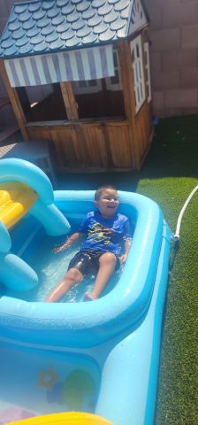 Isaiah playing in the water
